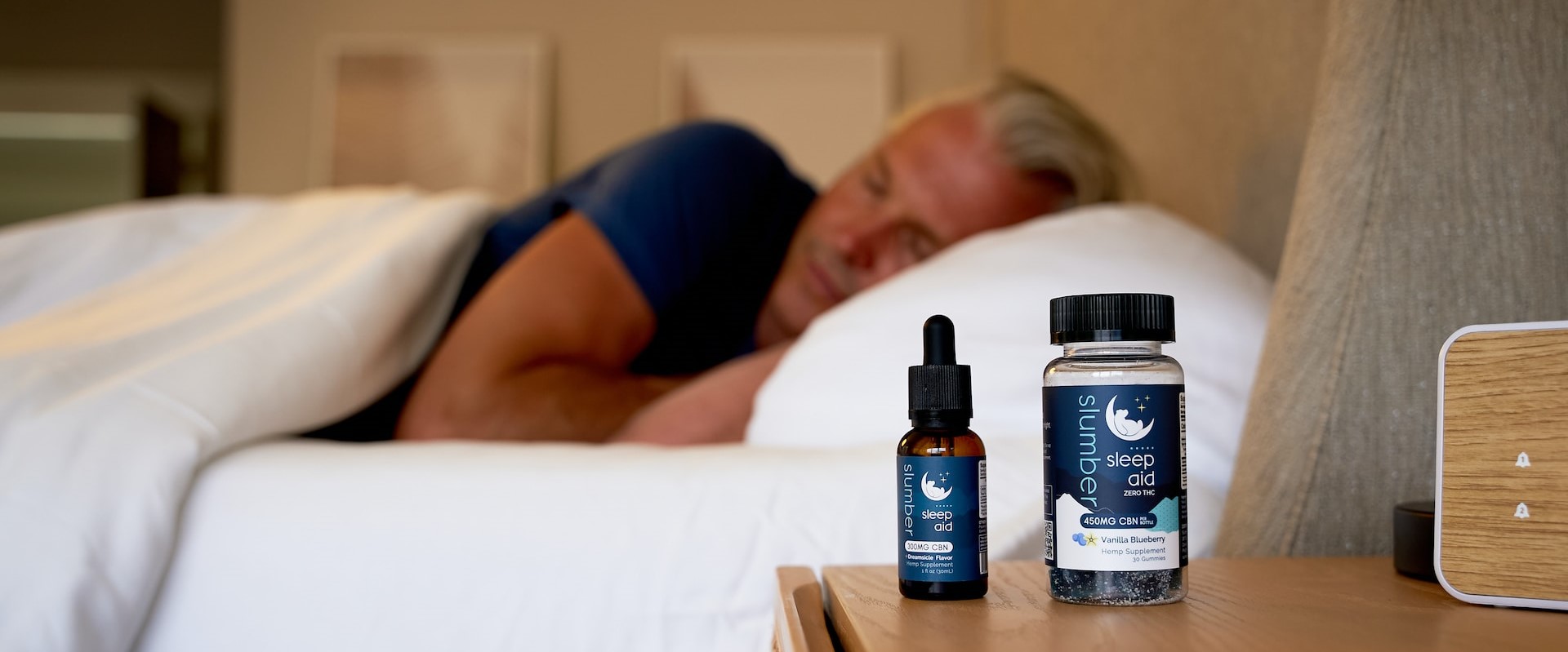 CBD oil bottle and a person sleeping peacefully